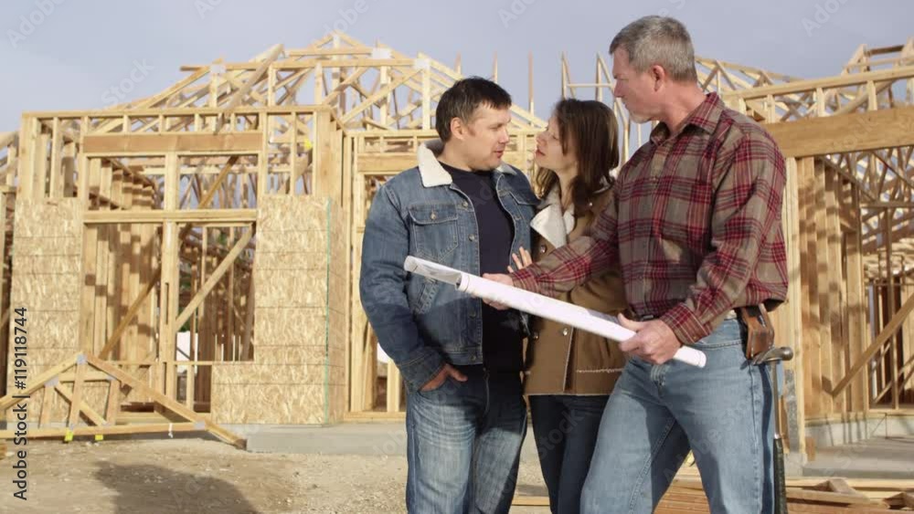 Couple speaking to contractor about floor plan Couple speaking to contractor about floor plan