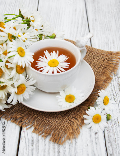 cup of herbal tea with chamomile flowers