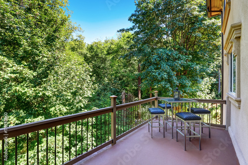 Second floor balcony with outdoor table and chair set