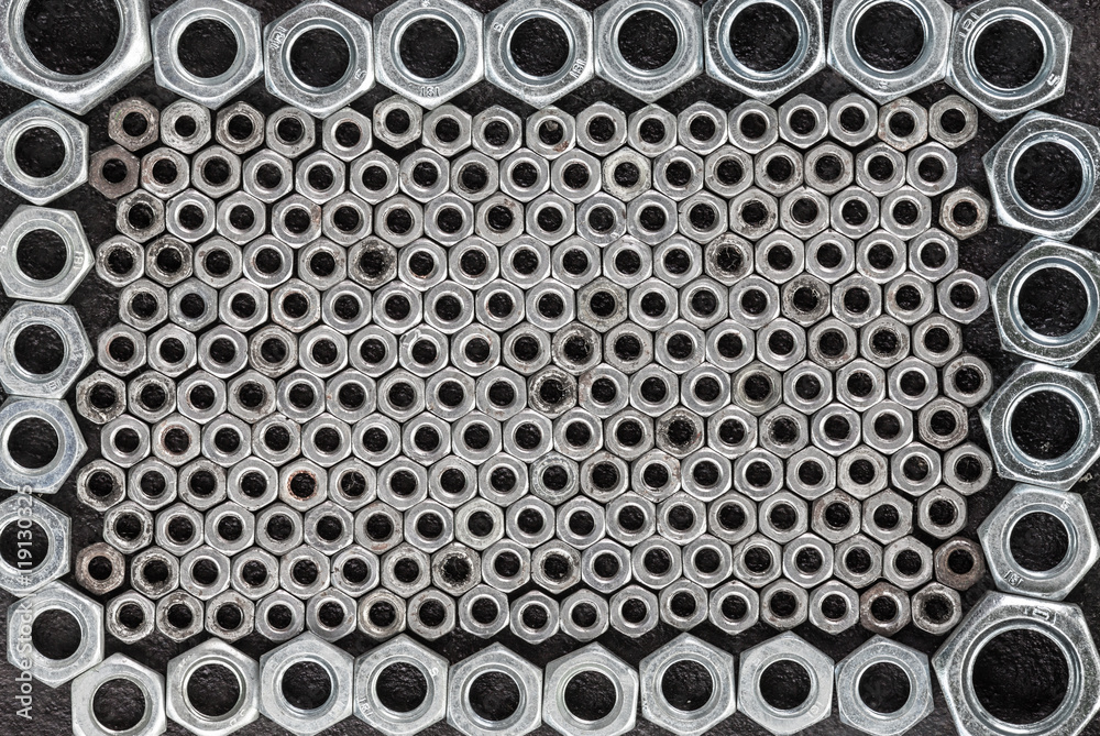 abstract background of metal nuts abstract background of metal nuts