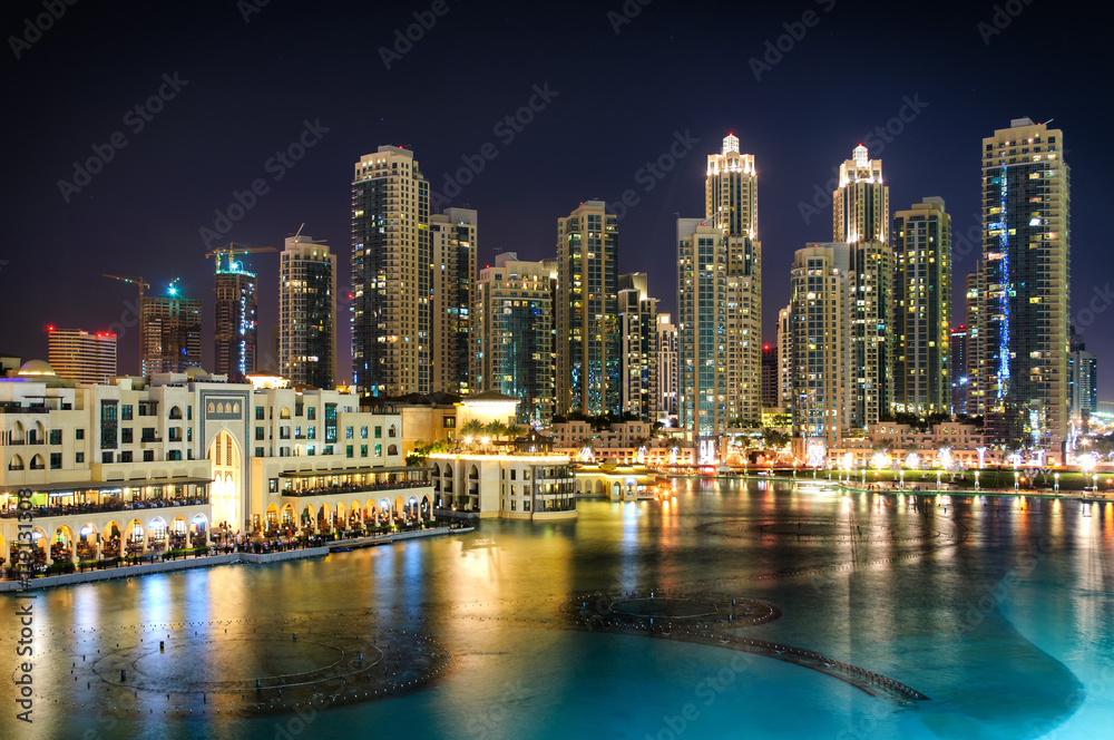 Φωτογραφία Amazing tallest skyscrapers in Sheikh Zayed road and Downtown area during calm night with colorful neons