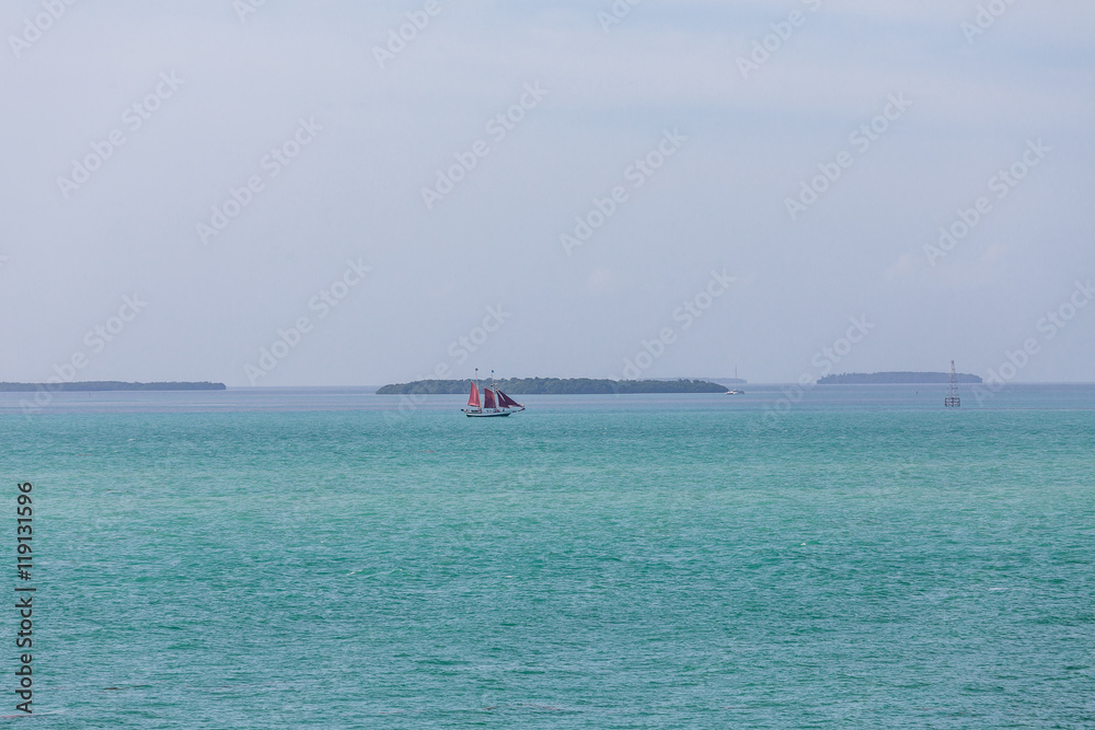Fototapeta premium Red Sails on Blue Horizon