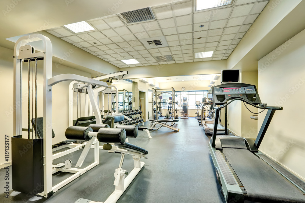 Interior of new modern gym with sport equipment Interior of new modern gym with sport equipment