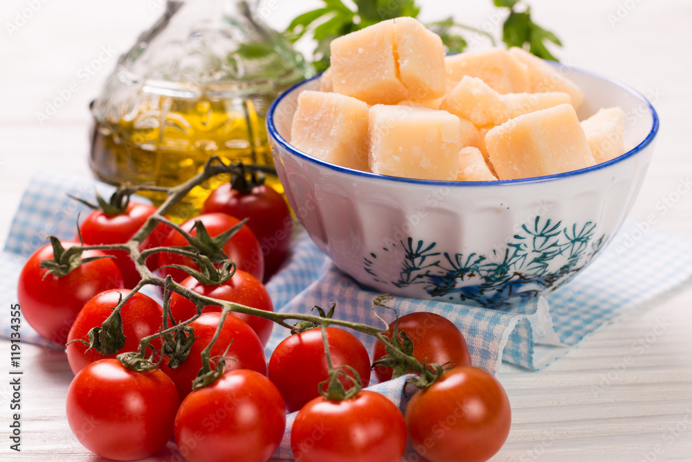 cheese , cherry tomatoes,oil and fresh parsley- ingredients for  salad