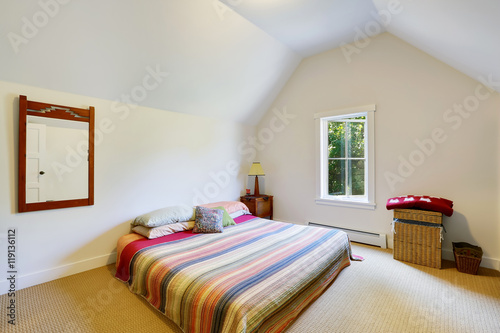 Simple design of attic bedroom with vaulted ceiling