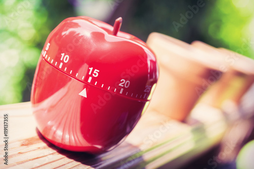 15 Minute Kitchen Egg Timer in Apple Shape Standing On A Handrail photo