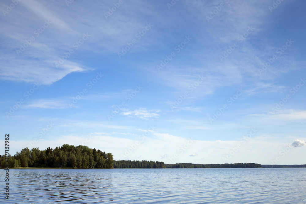 Landscape from Finland. An image of a scenery by the lake on a sunny summer day.