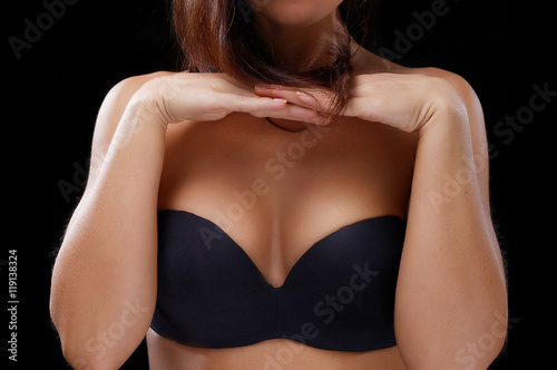Beautiful topless woman body covering her big breast