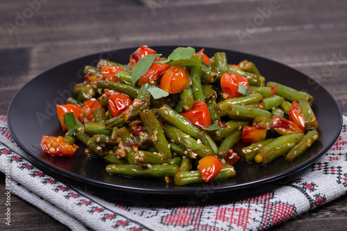 Healthy green beans, red cherry tomato with sesame seeds