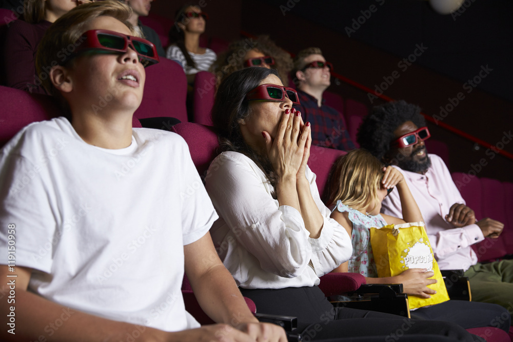Naklejka premium Audience In Cinema Wearing 3D Glasses Watching Horror Film