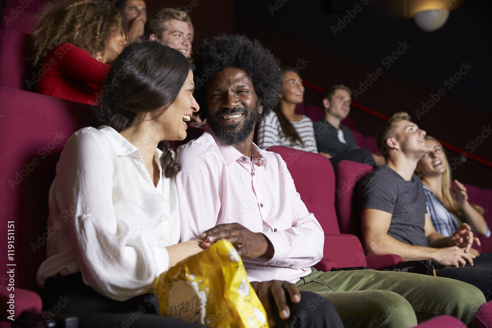 Fototapeta premium Couple In Cinema Watching Comedy Film