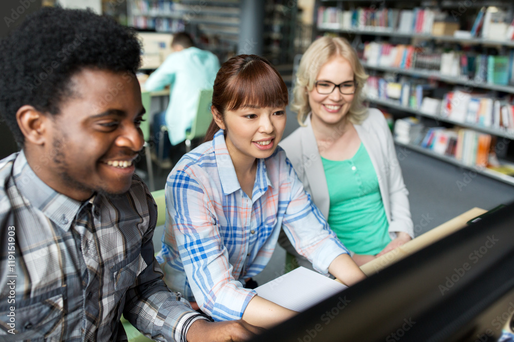 international students with computers at library