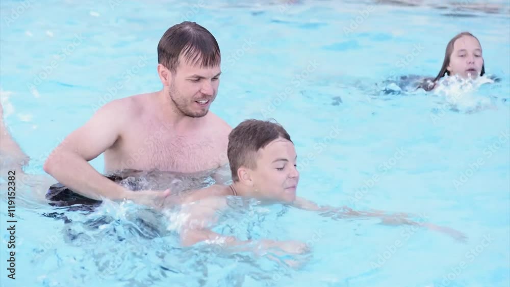 Happy family enjoying in pool Happy family enjoying in pool