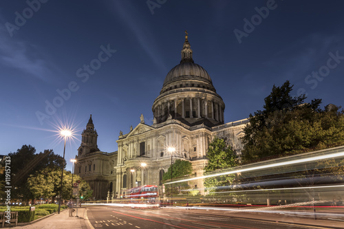 St Paul's Cathedral, at night, with traffic trails of London buses on the street in the forefront of the picture