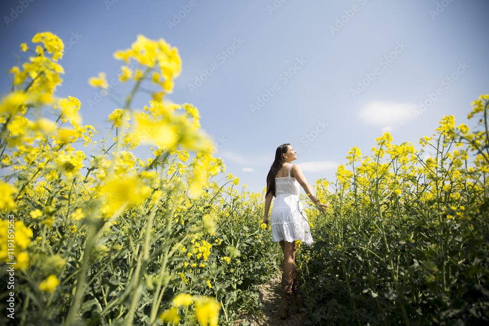 Young woman in the spring field Young woman in the spring field