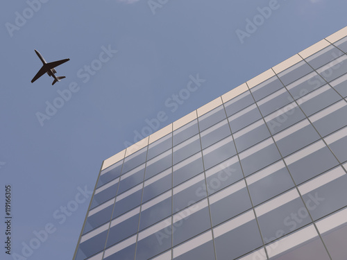 Airplane over office building