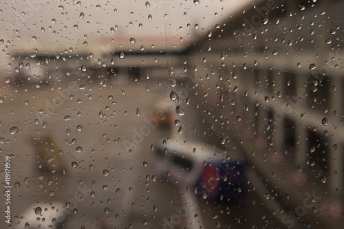 Raindrops on window glass blur background