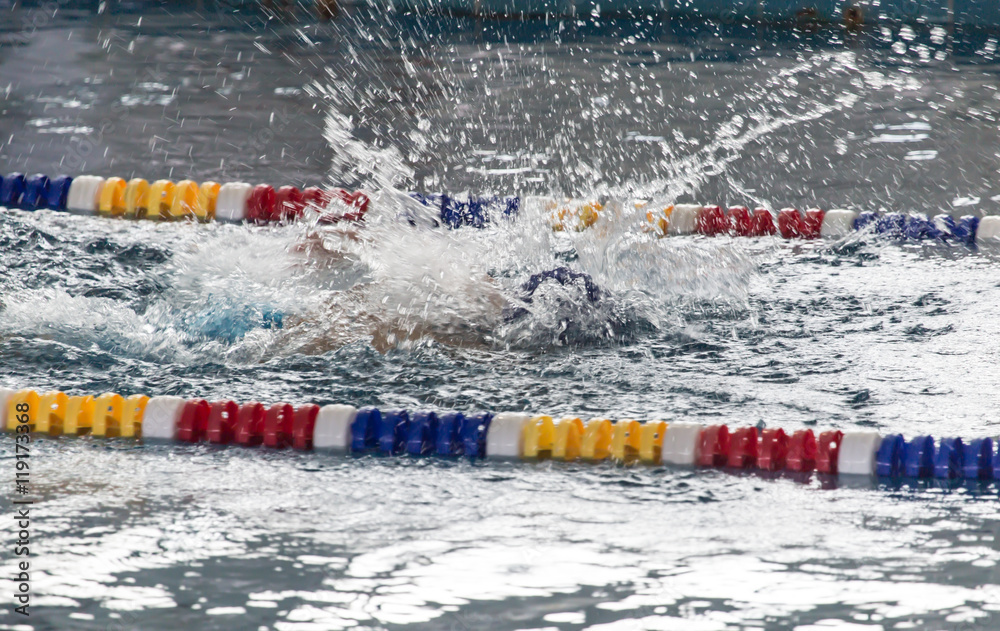 Naklejka premium boy goes in for sports in the pool