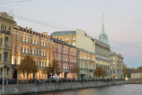 The embankment of the river Moika, singer in the evening