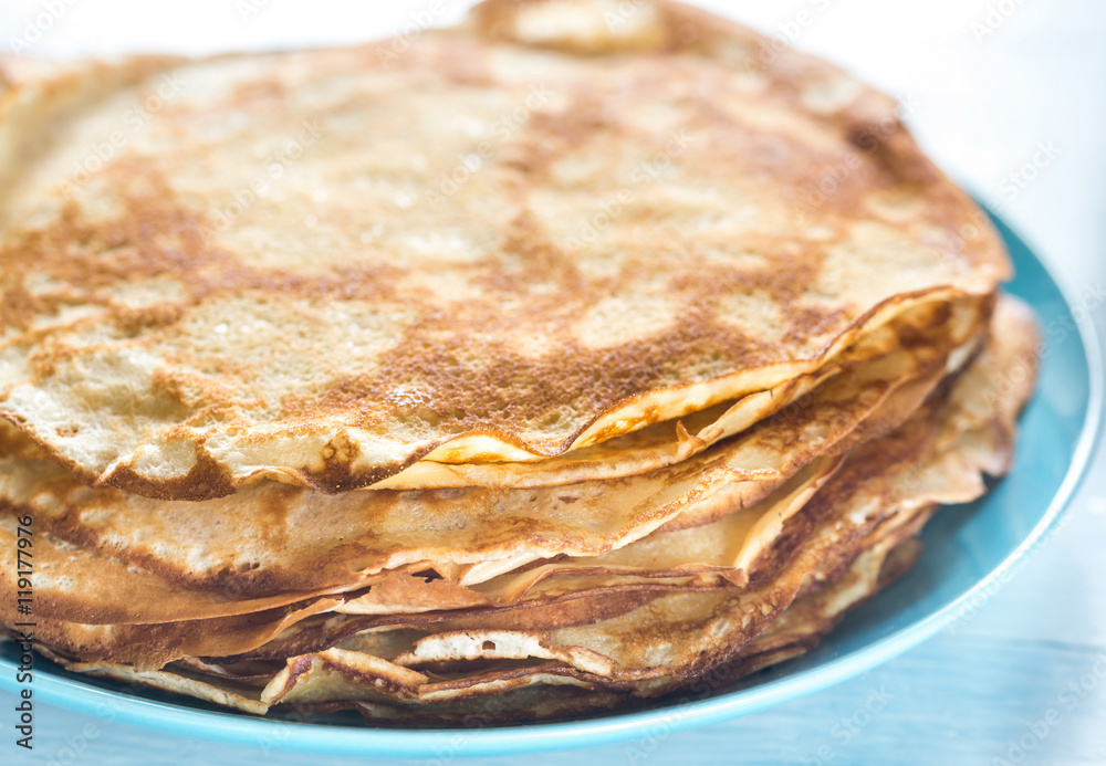 Pile of crepes on the plate Pile of crepes on the plate