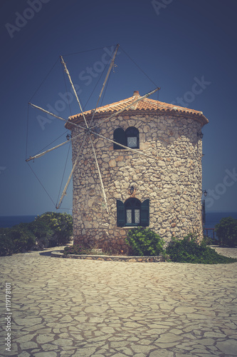 traditional old windmill on Skinari Cape, Zakynthos island, Greece
