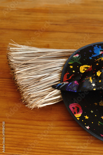 A colorful witches hat displayed with a broom