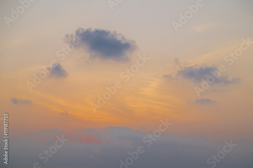 sunset sky with rays of light shining down pass clouds and sky © lukyeee_nuttawut
