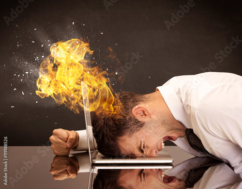 Stressed business man's head is burning