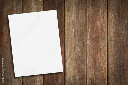 Obraz na płótnie Blank paper on wood table w salonie