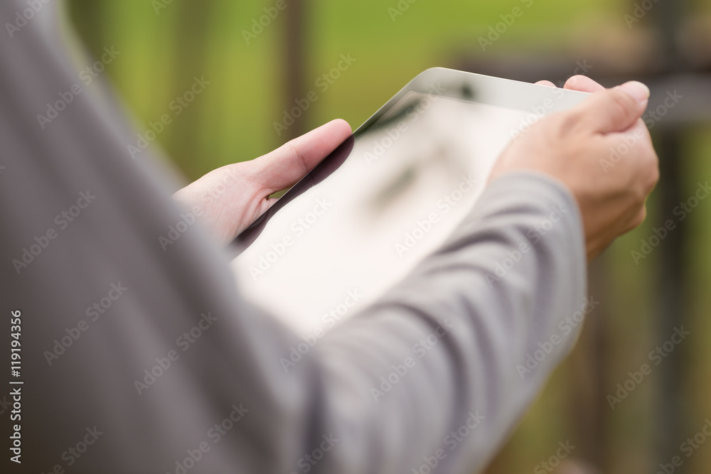 Man use tablet at park