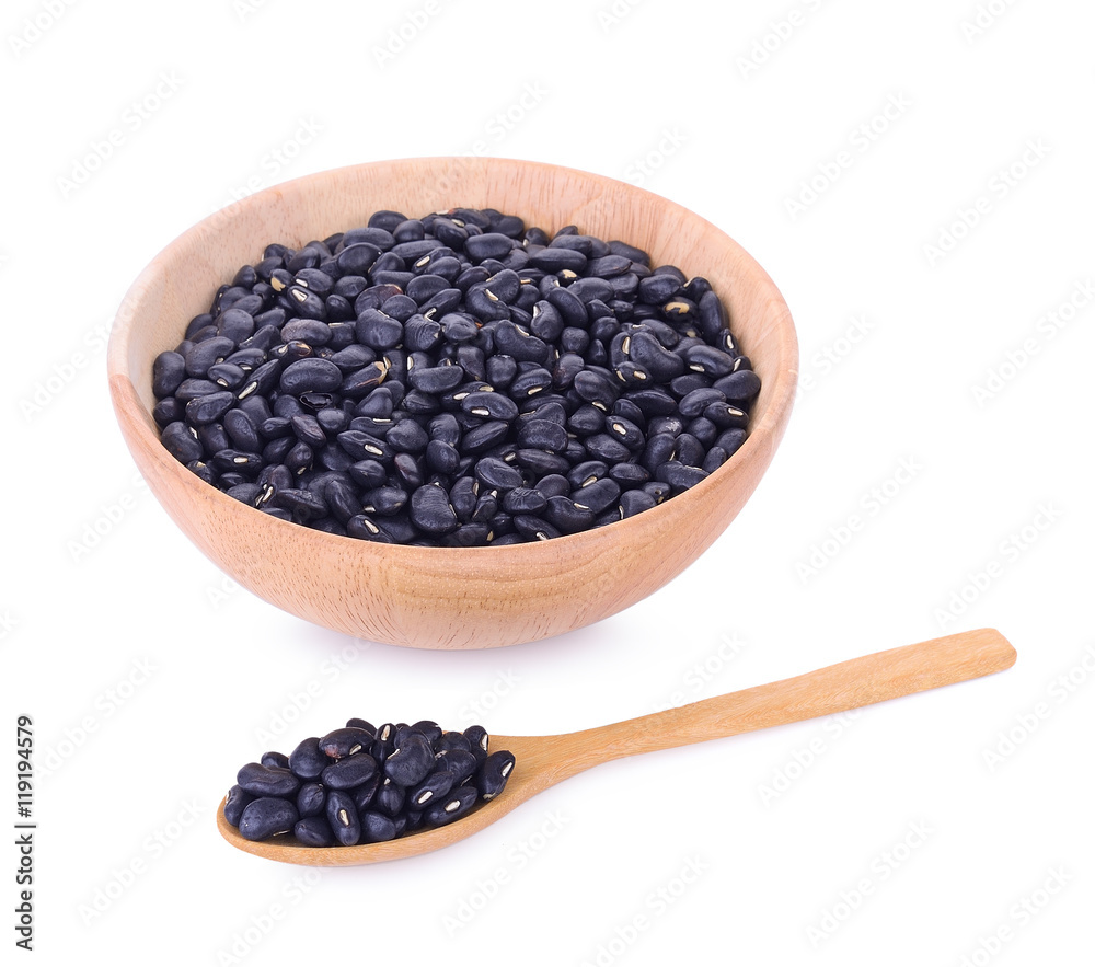 Black eyed peas beans in wooden bowl and spoon isolated on white Black eyed peas beans in wooden bowl and spoon isolated on white