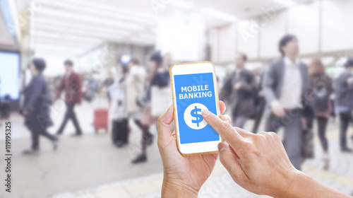 Hands holding smartphone with Mobile Banking application on scre