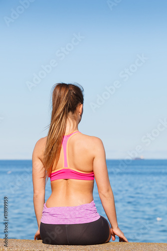 Woman resting relaxing after doing sports outdoors © Voyagerix
