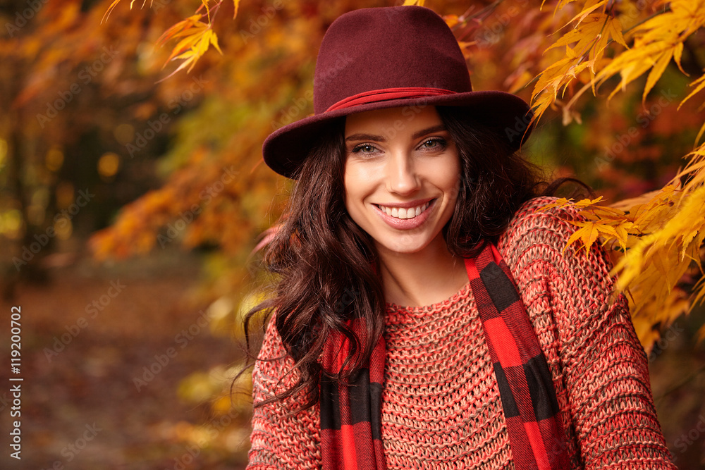 Fototapeta premium Beautiful elegant woman standing in a park in autumn , Fall conc