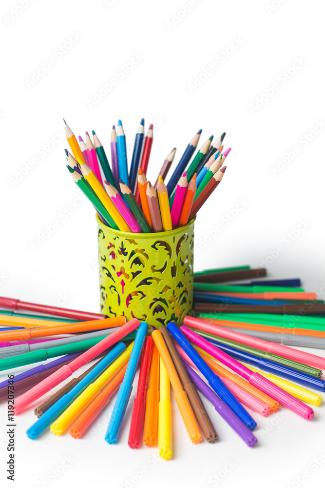 Fototapeta premium colored pencils and felt-tip pens on a white background