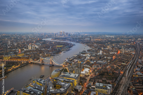 London  England - Aerial Skyline view of London with the iconic Tower Bridge  Tower of London and skyscrapers of Canary Wharf at dusk