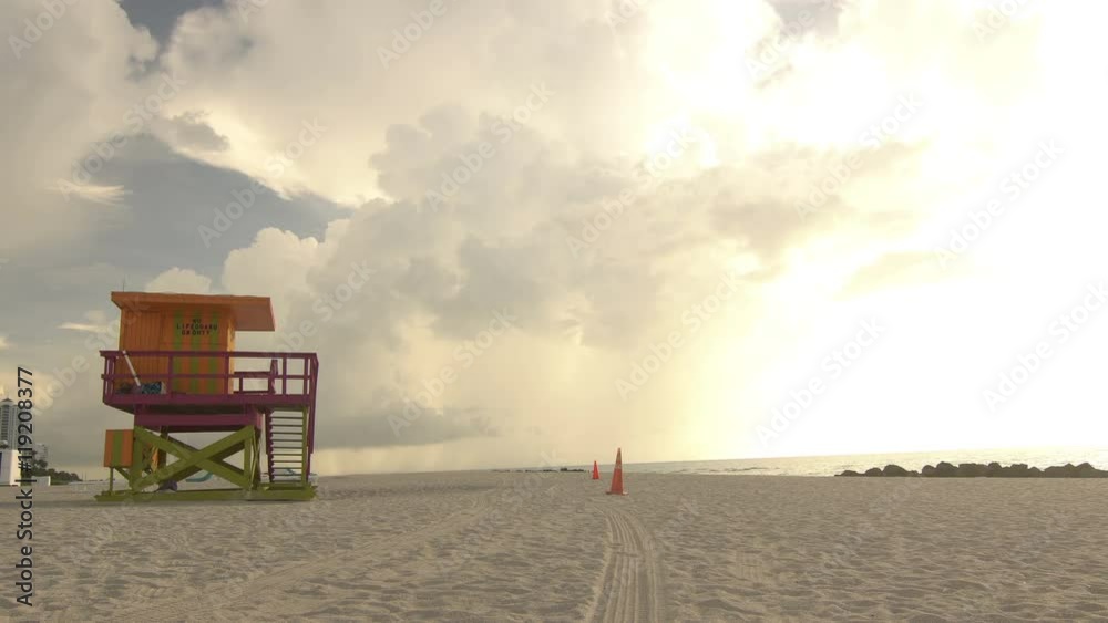 Lifeguard tower in Miami Beach shot early after sunrise, wide sandy beach Lifeguard tower in Miami Beach shot early after sunrise, wide sandy beach