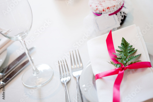 Wedding banquet, small restaurant floral, decor in red, informal style.