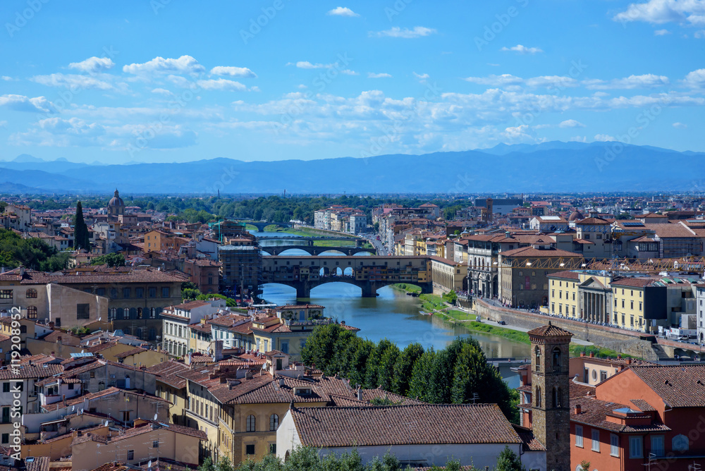 cityscape of Florence, italy / Arno river and old bridge (ponte vecchio)