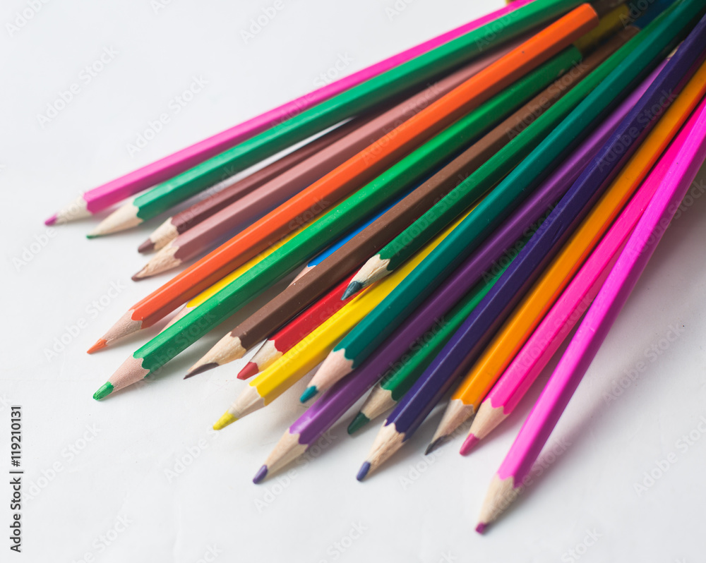 colored pencils and felt-tip pens on a white background colored pencils and felt-tip pens on a white background