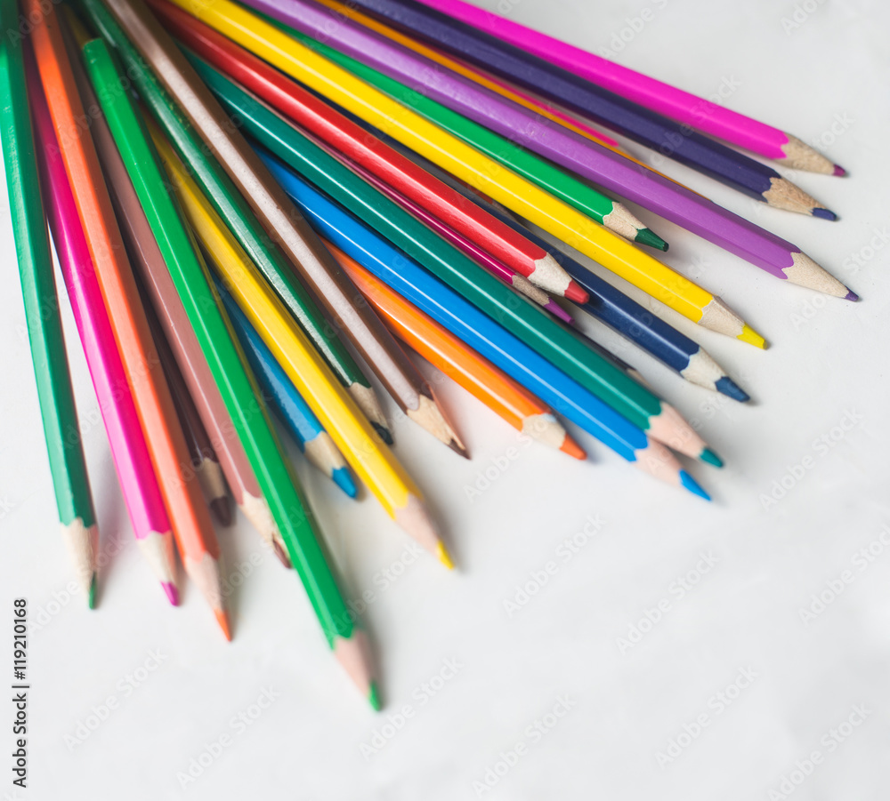 colored pencils and felt-tip pens on a white background colored pencils and felt-tip pens on a white background