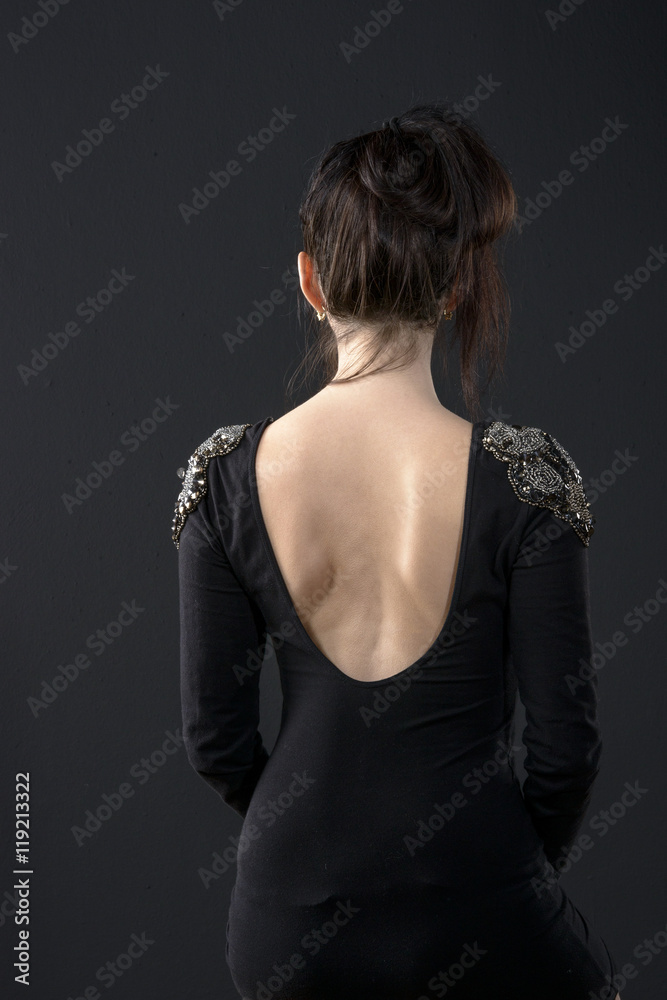 Fototapeta premium young women back on black background