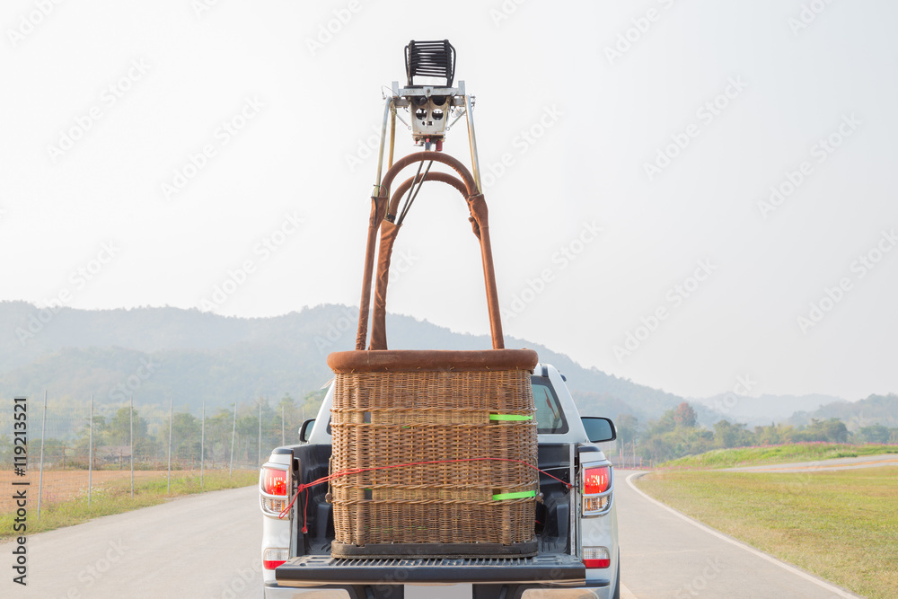 Fototapeta premium Car ride with the hot air balloon basket prepare to fire up the