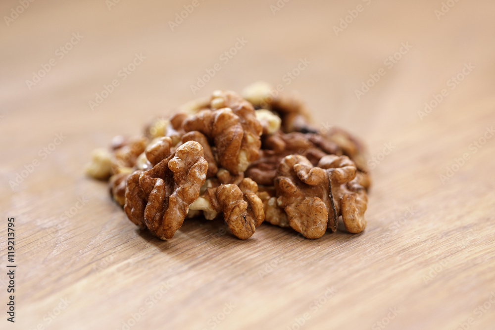 walnut kernels on aok wood table close up walnut kernels on aok wood table close up