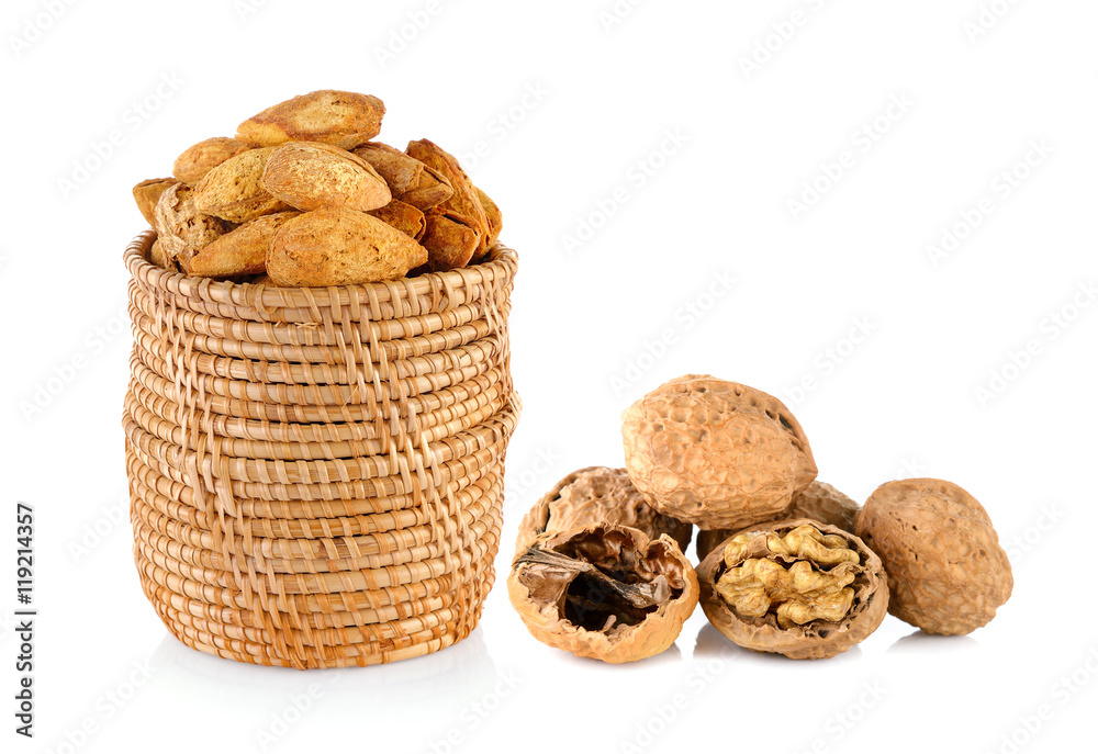 almonds and walnut and a cracked walnut isolated on the white ba almonds and walnut and a cracked walnut isolated on the white ba