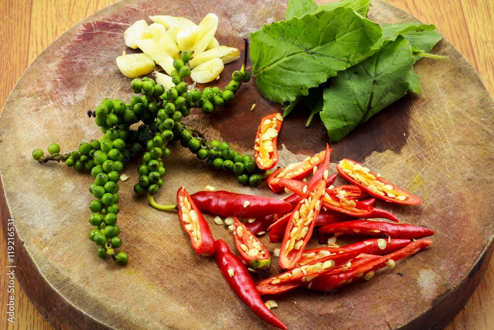 Herbs and other ingredients for Cooking Thai foods on a wooden cutting board. Herbs and other ingredients for Cooking Thai foods on a wooden cutting board.