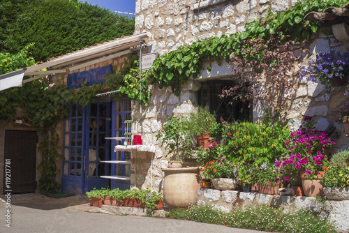 Rural house decorated with flowers in pots, Gourdon France photo