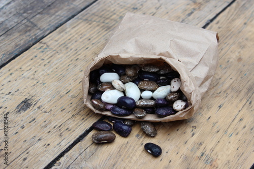 Multicolored bean in paper bag