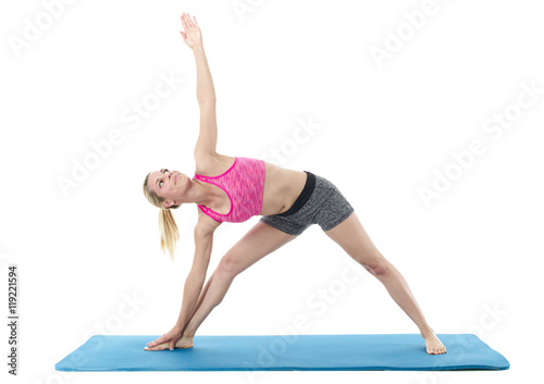 Young woman exercising on mat