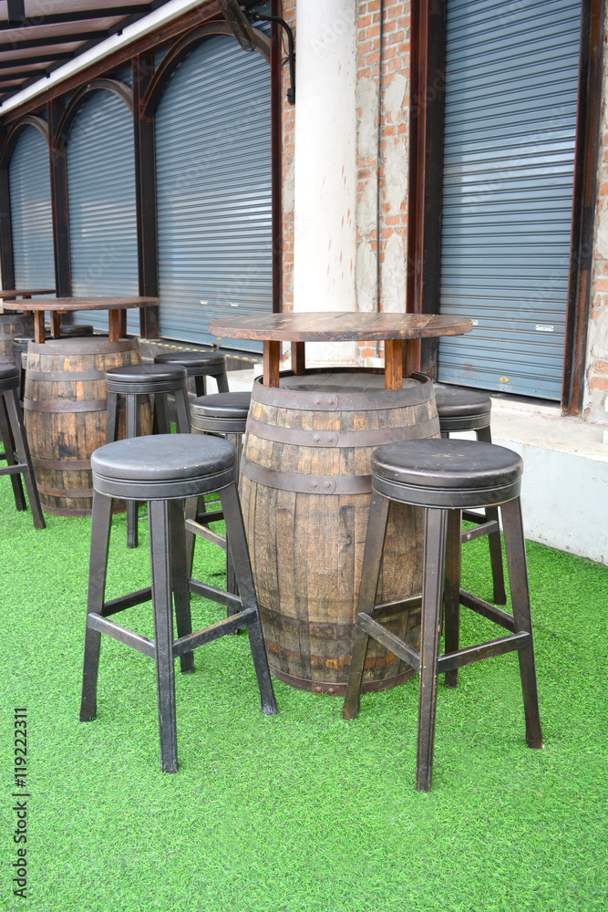 Wooden barrel table and chairs in empty beer garden. Stock Photo | Adobe  Stock